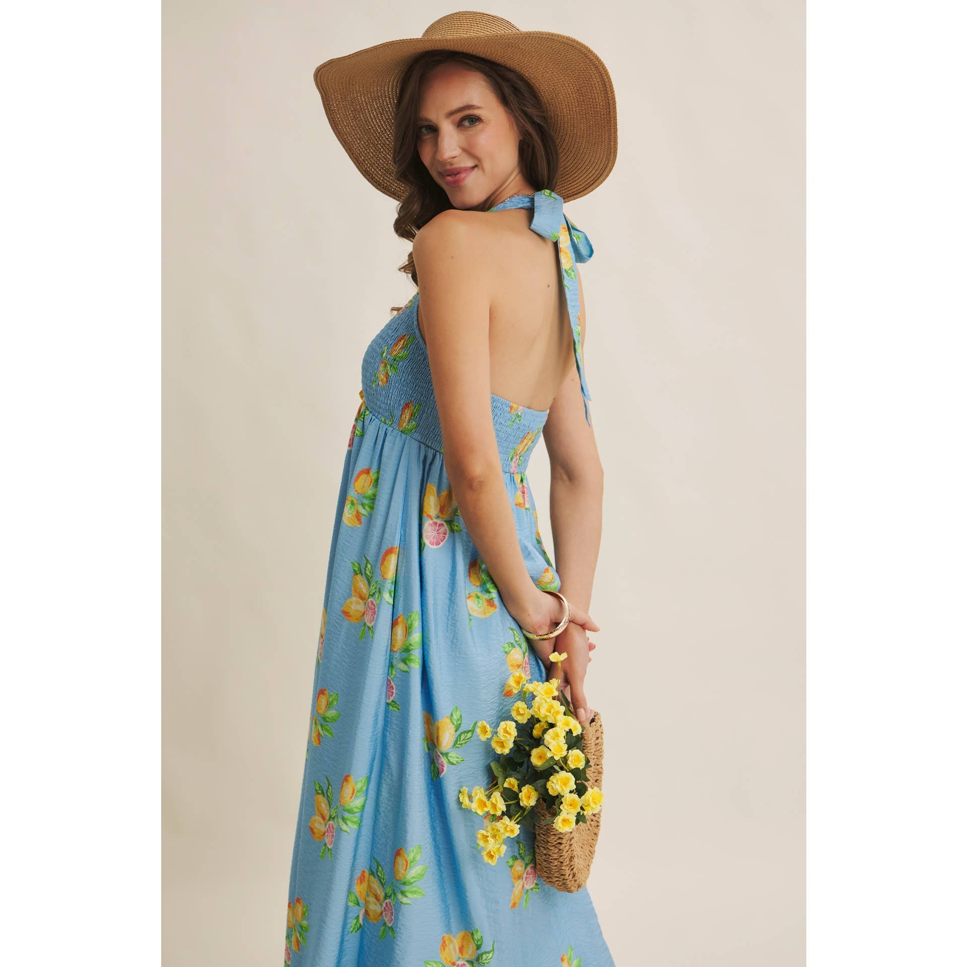 AMALFI COAST VIBE SMOCKED FLARE HALTER LEMON MIDI DRESS