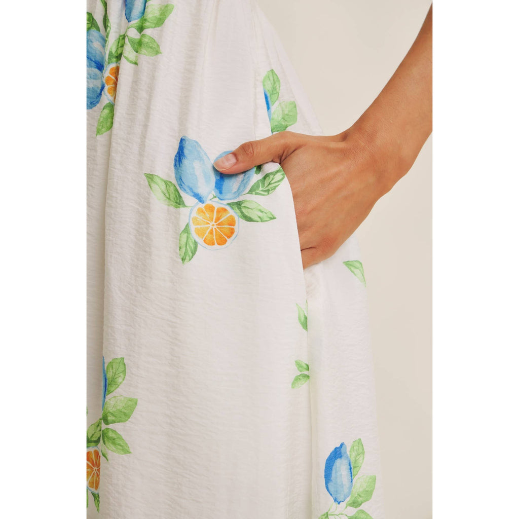 AMALFI COAST VIBE SMOCKED FLARE HALTER LEMON MIDI DRESS