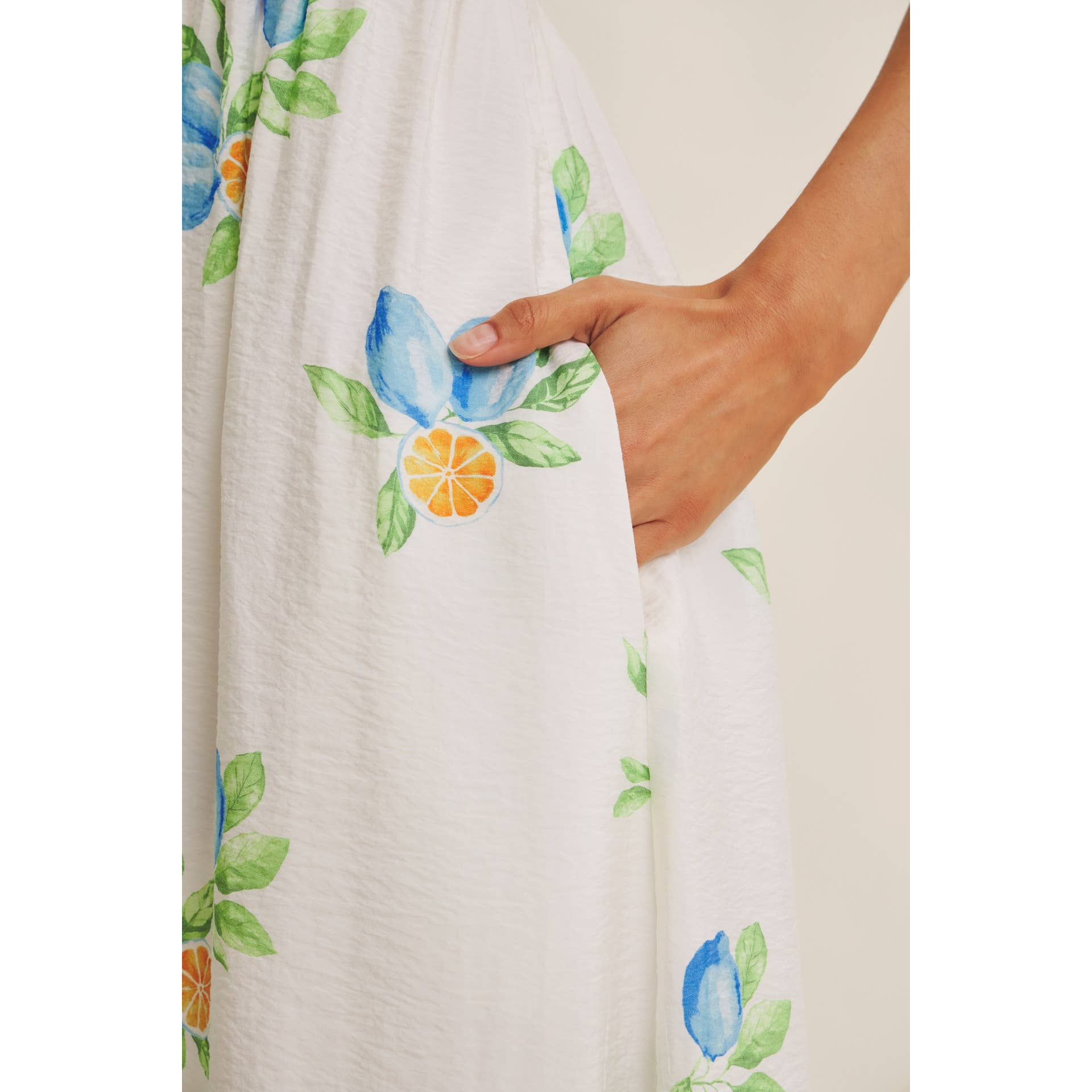 AMALFI COAST VIBE SMOCKED FLARE HALTER LEMON MIDI DRESS
