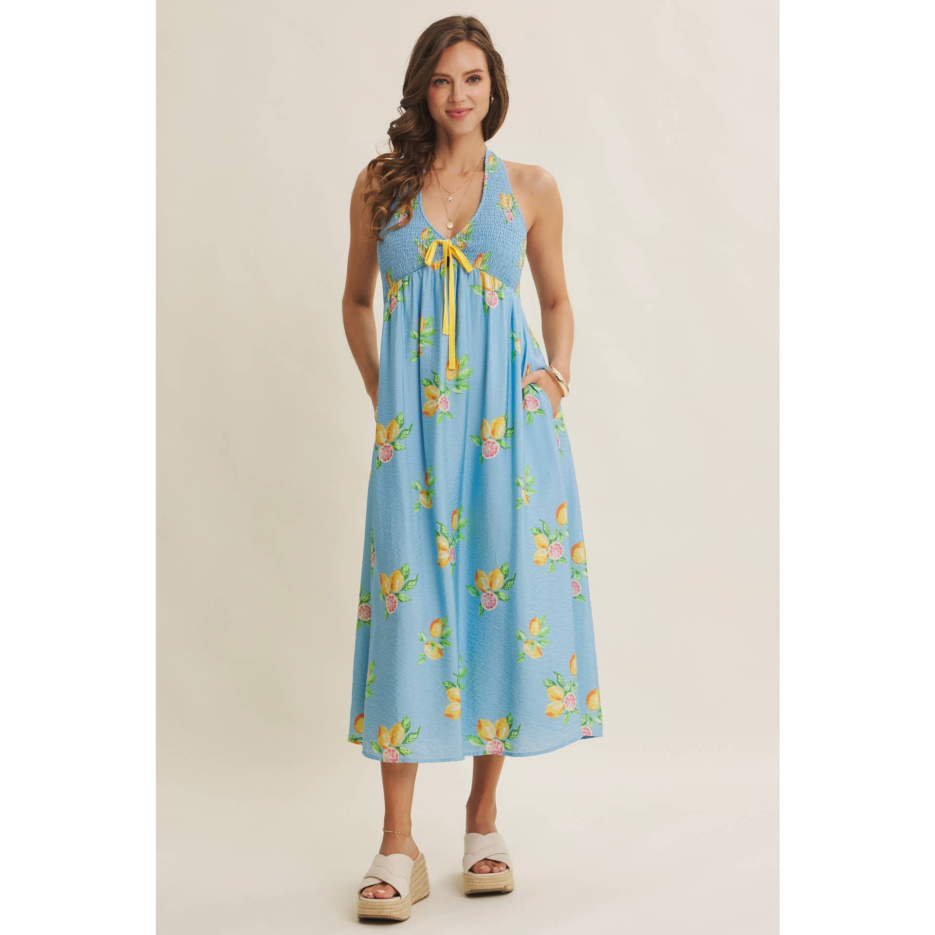 AMALFI COAST VIBE SMOCKED FLARE HALTER LEMON MIDI DRESS